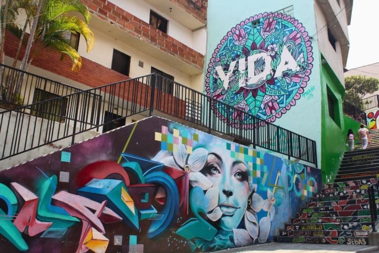 Colorful mural saying “Vida” in Comuna 13 Medellin