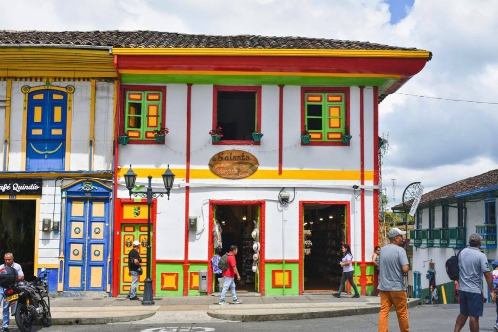 Row of colorful colonial buildings with wooden balconies in Salento
