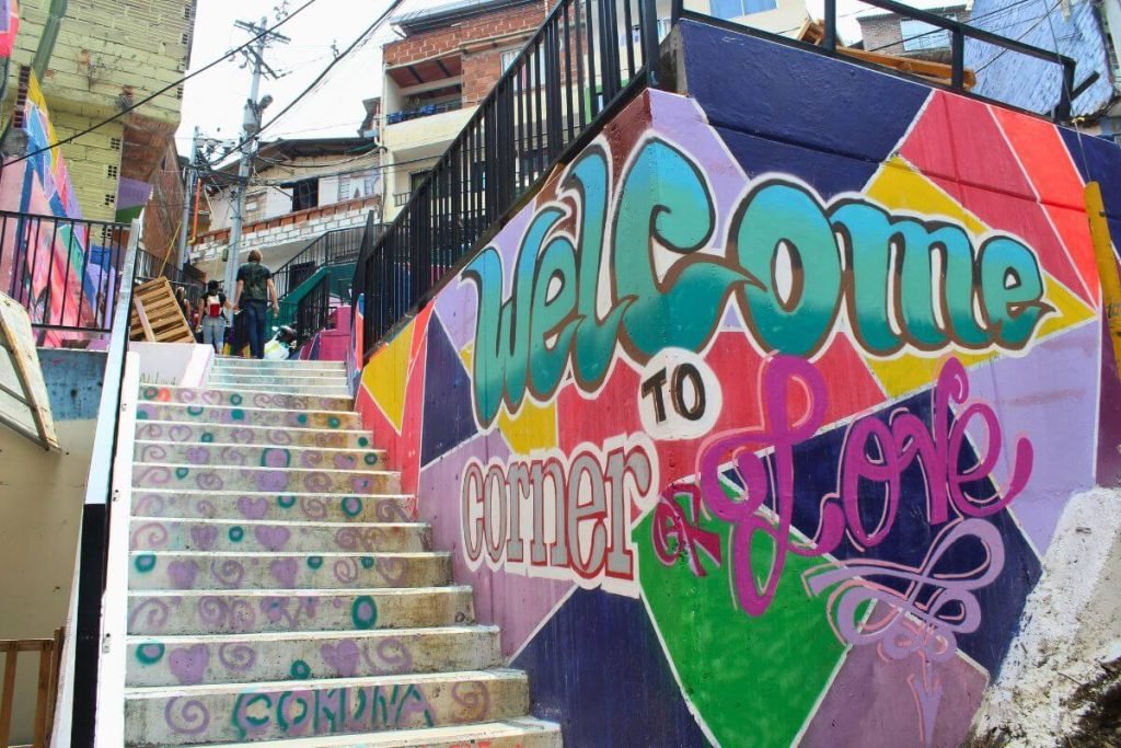 Painted stairway with “Welcome to the Corner of Love” in Comuna 13 Medellin