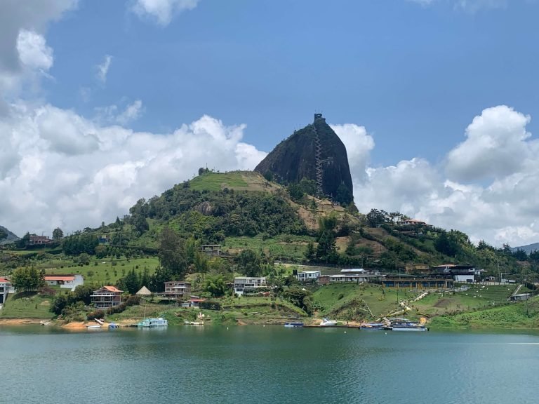El Peñol rock rising above the lake near Guatape, Colombia, seen from the waterfront